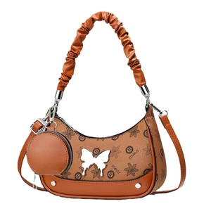 Brown monogram half-moon hobo bag with butterfly hardware and round coin purse charm