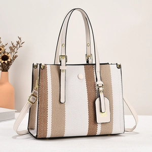Chic color-block canvas tote bag with leather trim and gold hardware for daily use