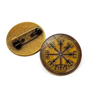 Nordic Viking compass brooch with bronze finish and glass dome showing front and back views
