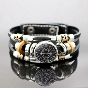 Detailed close-up of multilayer leather bracelet with Viking Vegvisir compass and runes