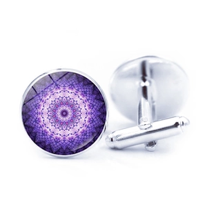 Detailed macro view of silver-tone cufflinks with purple mandala geometric patterns