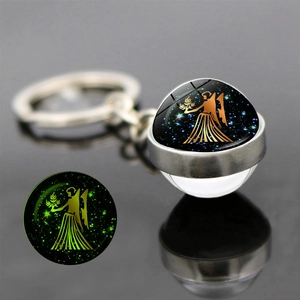 Luminous Virgo zodiac keychain with double-sided glass ball glowing in the dark