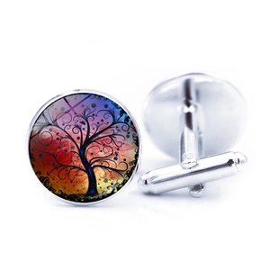Silver cufflinks featuring a tree of life design with vibrant gradient background colors