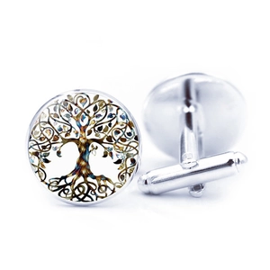 Detailed view of silver tree of life cufflinks with polished glass dome and artistic patterns