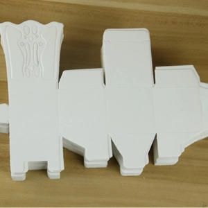 European chair style candy box made of white cardstock with embossed geometric patterns
