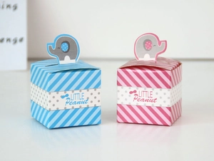Detail of pink and blue elephant baby shower candy boxes with Little Peanut text