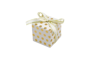 Detail view of white square gift box with gold foil polka dots and ribbon bow closure