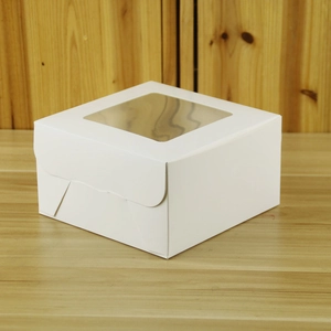 Macro detail of white cupcake box with clear window and insert for 4 muffins