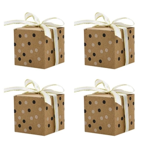 Square kraft gift boxes with gold-edged white ribbons and stylish polka dot patterns