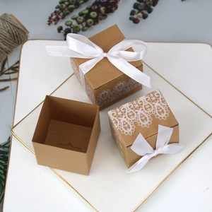 European kraft paper candy gift box with white lace print and satin ribbon bow decoration