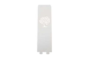 Detail of laser-cut white paper candy box with intricate tree patterns and foldable design
