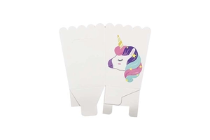 Close-up of unicorn party gift boxes with wave edge design and colorful printed patterns
