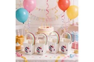 Close-up of unicorn party gift bags with rainbow handles and colorful illustrations