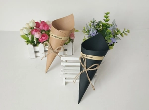 Detail of cone-shaped kraft paper flower bouquet holders in black and wood tones