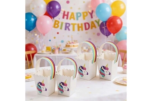 European unicorn gift bags with wavy edges and rainbow handles for birthday parties