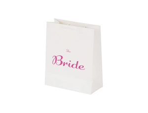 Detailed close-up of a white paper wedding gift bag with pink The Bride lettering