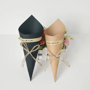 Brown and black kraft paper cone gift wrap with hemp rope bows and sentiment stickers
