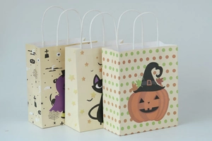 Three Halloween gift bags featuring pumpkin, black cat, and tombstone cartoon designs