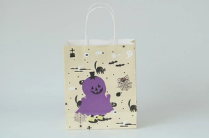 Detail of Halloween paper gift bag with purple pumpkin, spider web and ghost patterns