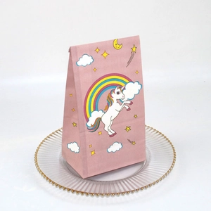 Pink unicorn gift bags for party favors with rainbow and star patterns on white background