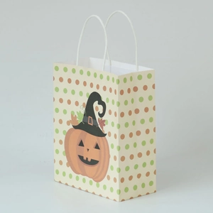 Halloween kraft paper gift bag featuring cartoon pumpkin with witch hat and white handles