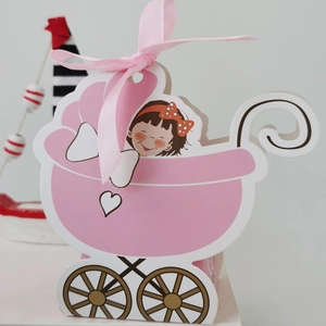 Detailed view of a pink baby carriage gift box with silk bow and cartoon illustration
