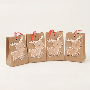 Set of 4 Christmas kraft gift bags with reindeer patches and red ribbon ties
