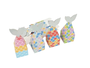Mermaid party favor boxes featuring glitter fish tail toppers and colorful scale patterns