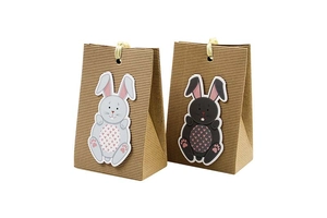 Detail of kraft paper Easter bunny gift bags with ribbon handles and textured finish