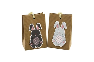 Detailed macro of kraft paper texture and cartoon rabbit motif on festive gift bag