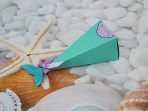 Detail of teal mermaid candy box with purple bow and shell Thank You sticker