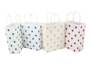 Detailed view of four colorful star pattern paper gift bags with twisted handles