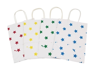 Close-up of white paper gift bags with colorful star patterns and twisted rope handles