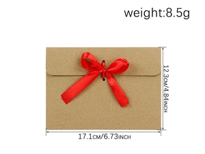 Detailed dimensions of brown kraft envelope with red ribbon bow measuring 17.1x12.3 cm