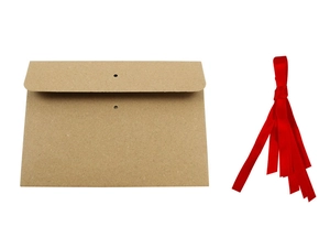 Detail of brown kraft paper envelope with two holes and a red satin ribbon accessory