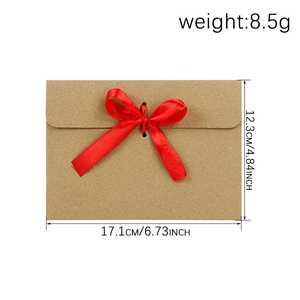 Kraft paper gift envelope with red ribbon bow and detailed dimension measurements