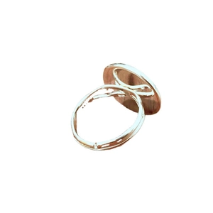 Adjustable silver flower ring with round flat setting and minimalist open band design