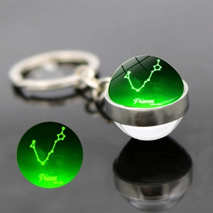 Portachiavi con sfera di vetro luminosa bifacciale con segno zodiacale Pesci e bagliore