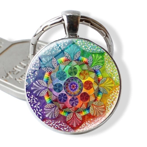 Yoga Mandala keychain with glass pendant and colorful kaleidoscope pattern on white base