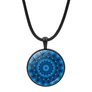 Macro detail of Mandala glass dome pendant featuring a blue geometric kaleidoscope pattern