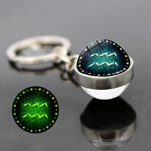 Glow in the dark Aquarius zodiac keychain with a double-sided luminous glass ball