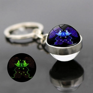 Luminous Gemini zodiac keychain with crystal glass ball and glowing effect for backpack