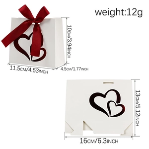 White heart cutout gift bag with red ribbon bow for Valentine's wedding favors