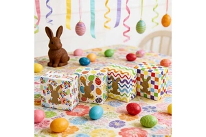 Close-up of Easter gift boxes with bunny cut-out windows and colorful festive patterns