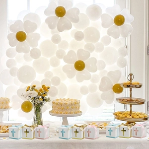 Detailed view of hollow cross party gift boxes with satin ribbons for baptisms