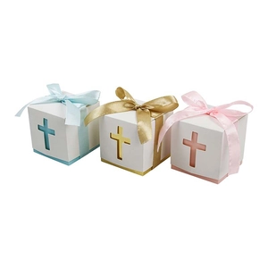 Three hollow cross gift boxes in blue, gold and pink with matching silk ribbons for baptisms