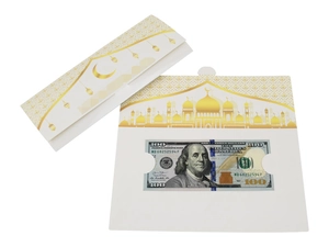 Detail of Eid money envelope with gold mosque and crescent moon design on white cardstock