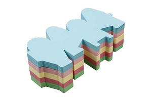 Detail showing colorful tiered wedding candy boxes with scalloped edges and ribbon bows