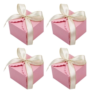 Pink square wedding favor boxes with wavy edges and elegant cream satin ribbon bows