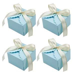 Set of four light blue square wedding candy gift boxes with ribbon bows and wavy edges